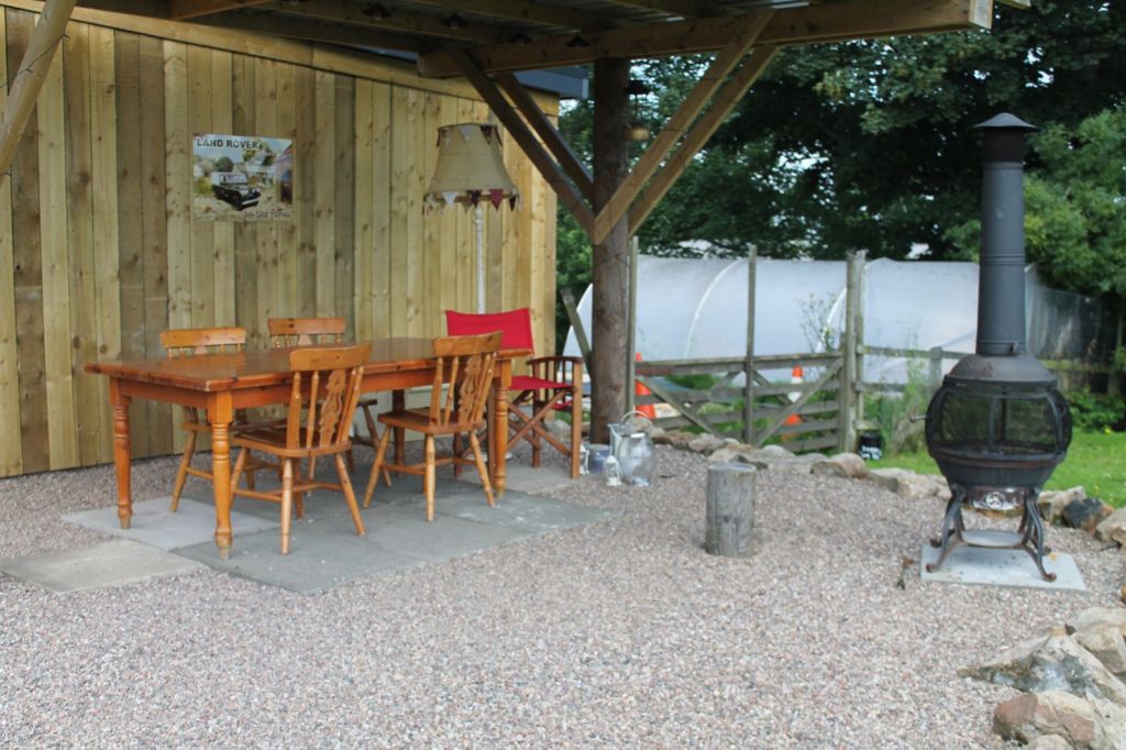 The outdoor table/BBQ next to the Byre